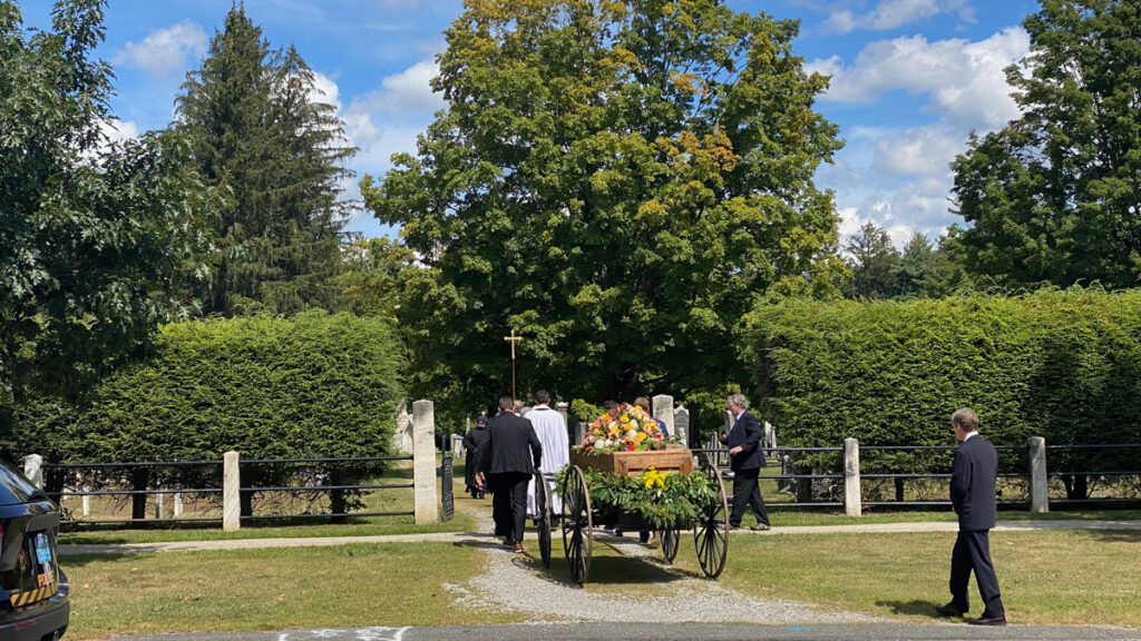 Virginia "Ginger" Schwartz is laid to rest. In every Sedgwick funeral since Theodore, a cart like this one was used. Photo: Patrick White