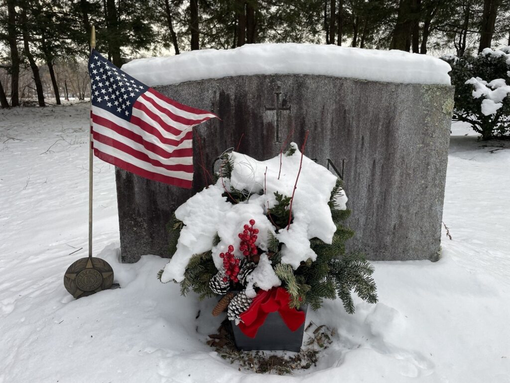 Photo of my family's gravesite, St. Joseph's Cemetery, Winter 2026.
The flag appears to be waving in the wind.
It's actually frozen in place, unable to wave freely.
Like our democracy at the moment.
The flag commemorates my Dad's service in WWII, fighting fascism.
The flag, like our country, waiting for a thaw.
