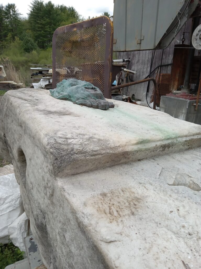 Statue outside of a barn